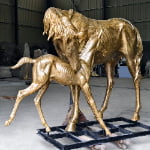 bronze statue of a mare and foal