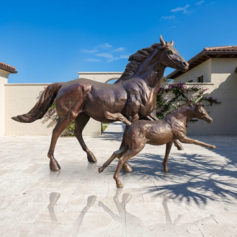 statue of a mare and foal playing for outdoor