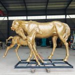 group statue of a mare and foal