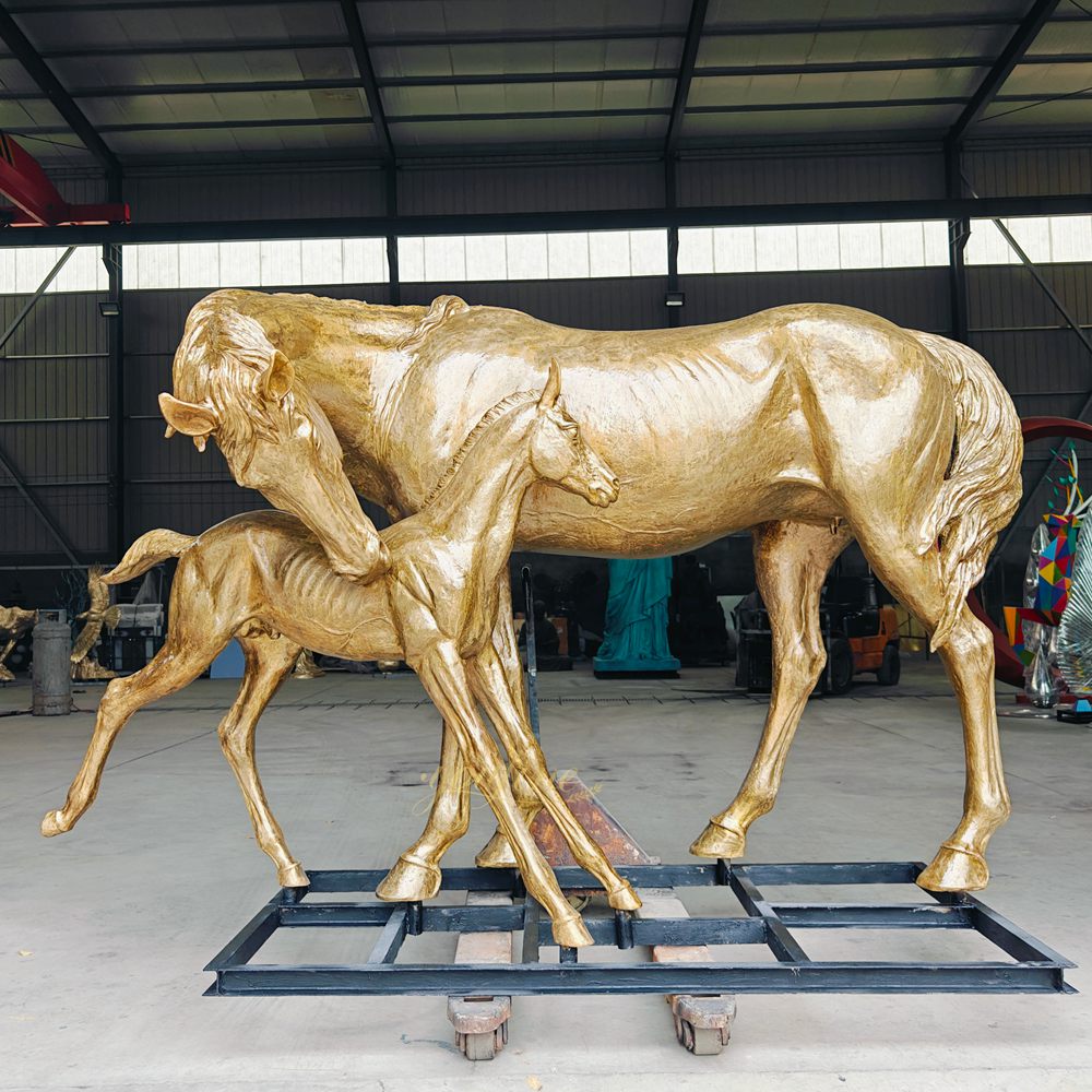 group statue of a mare and foal