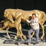 lifesize bronze statue of a mare and foal