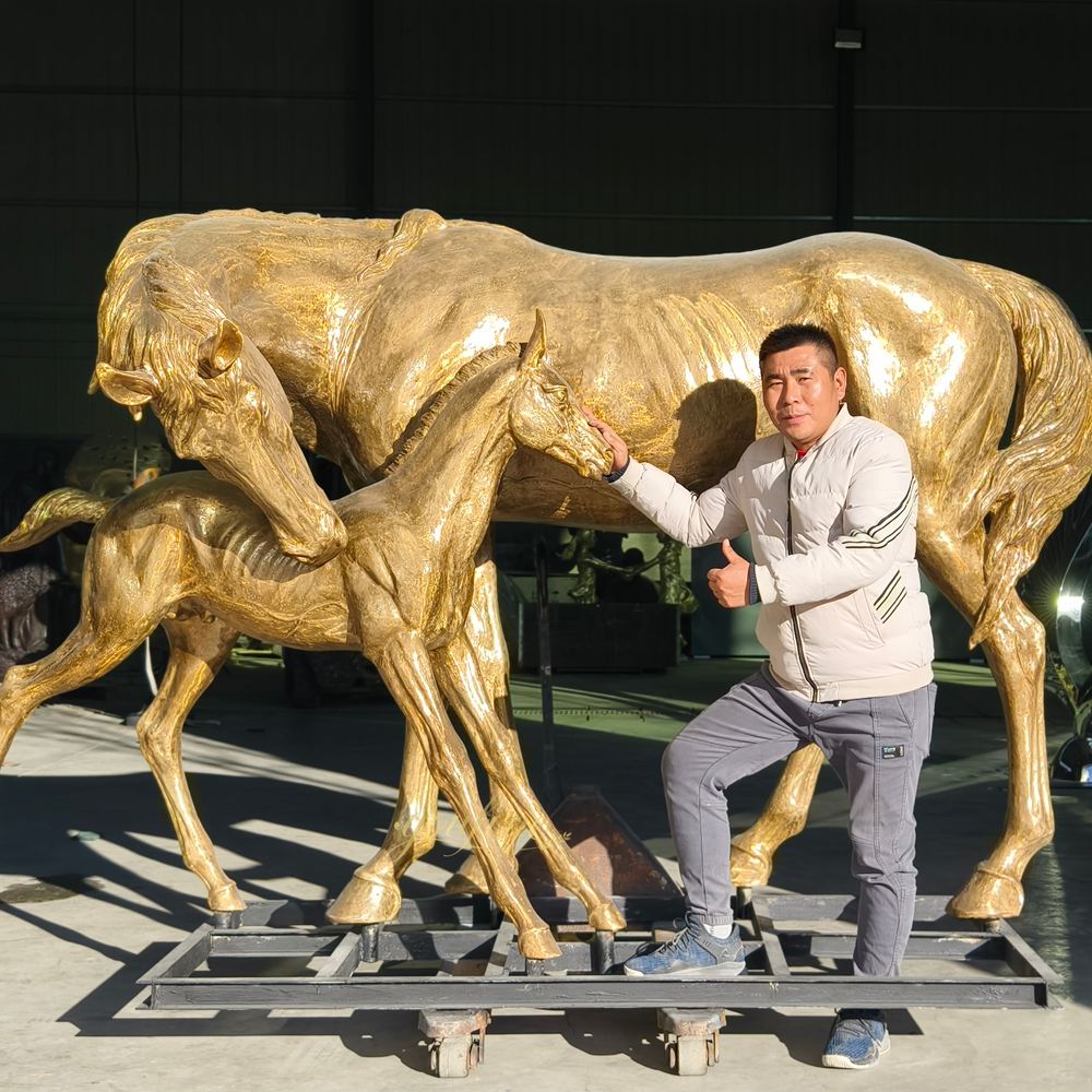 lifesize bronze statue of a mare and foal