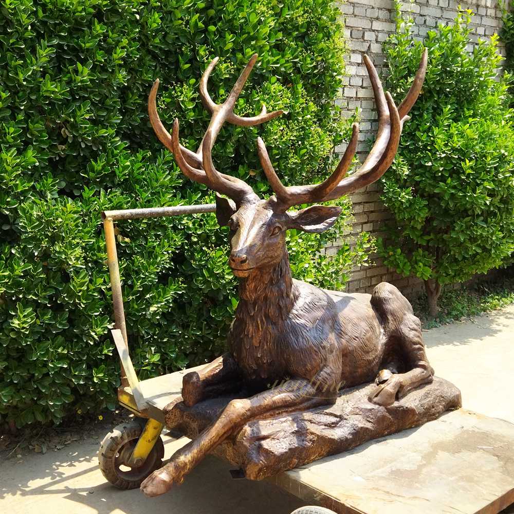 Elegant Crouching Deer Statue