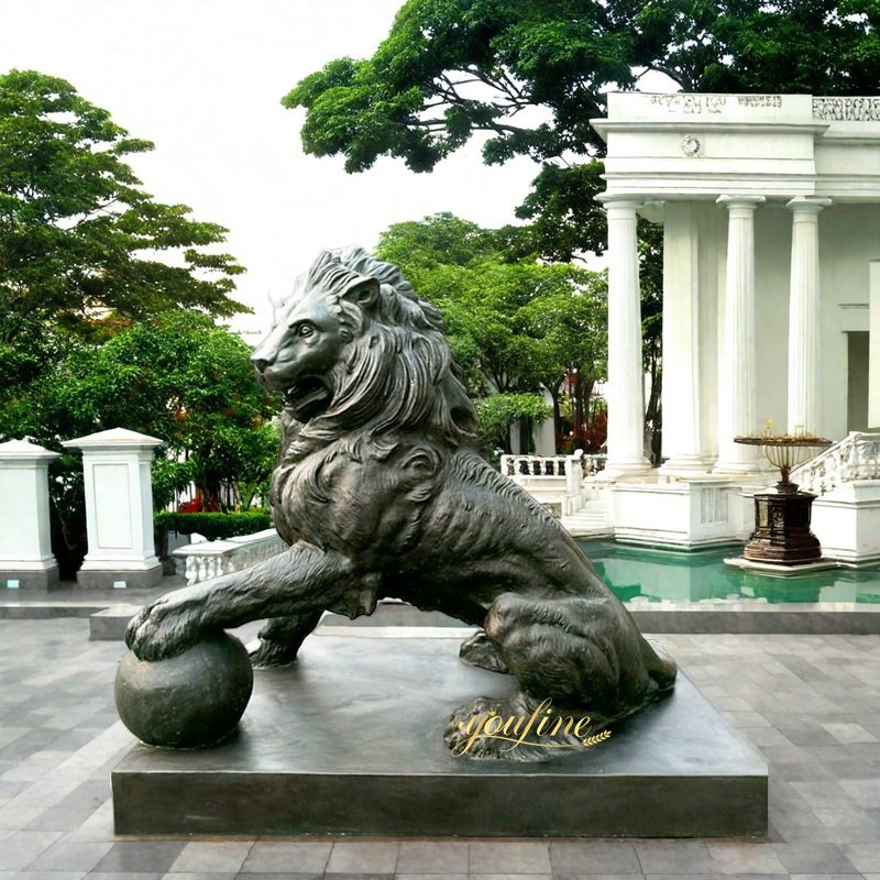 lion statue outside house with ball