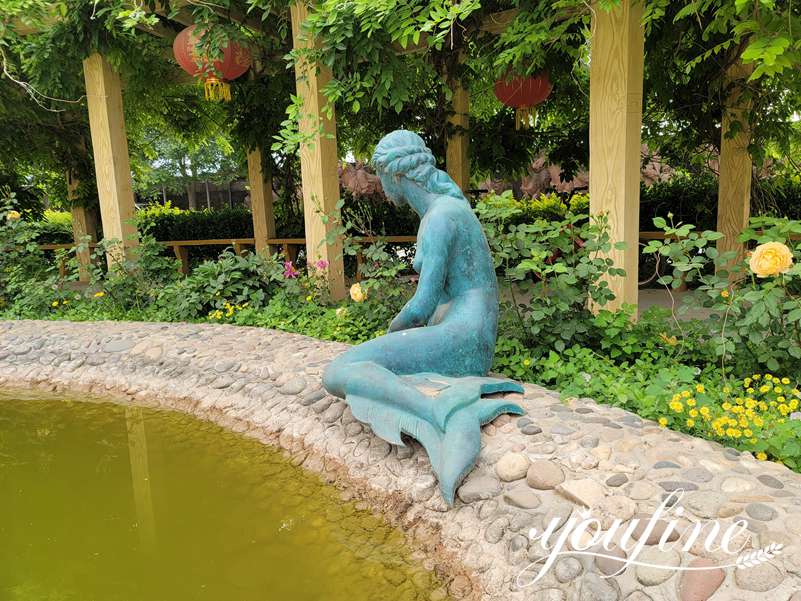 large bronze mermaid statue