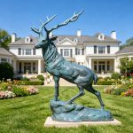 Standing on the Rock Elk Statues with green patina in the villa garden