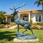 bronze Elk Statues with green patina in the villa garden