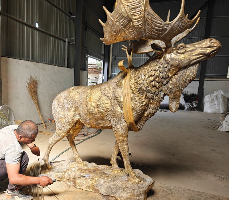 Our artists are welding a bronze moose sculpture
