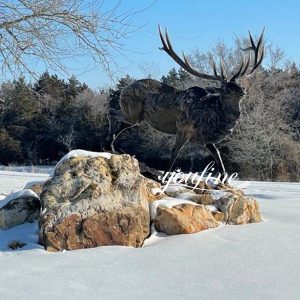 Bronze Elk Sculpture Stands Tall in Ice and Snow
