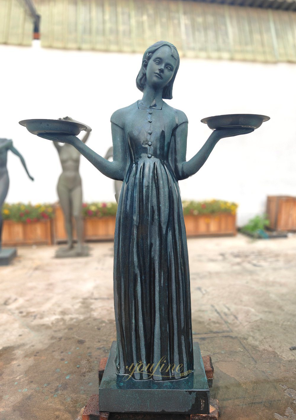 A bronze Bird Lady statue cast by our factory for a client.