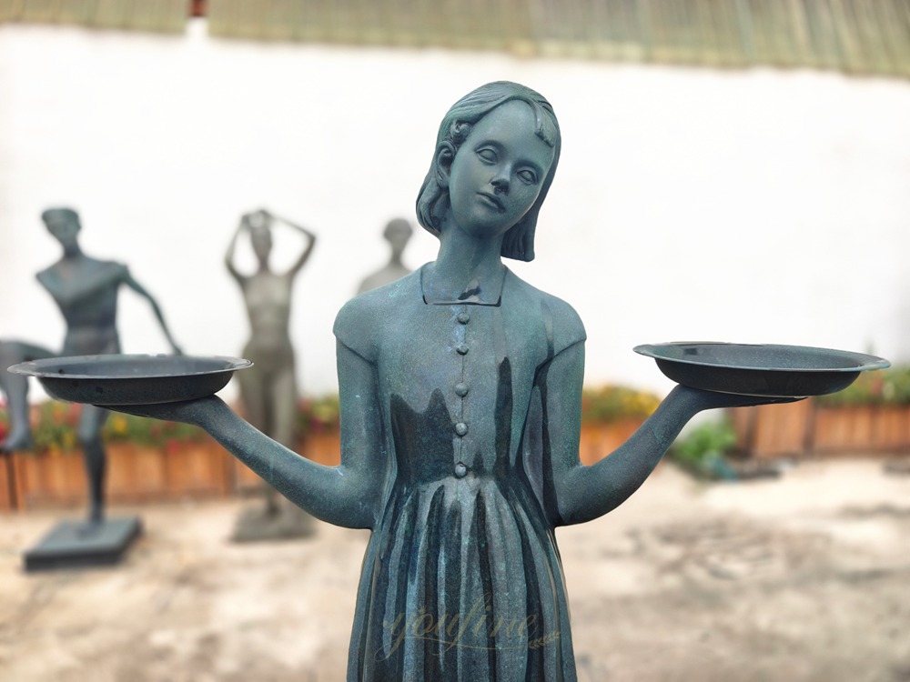 This is a close-up image showing the facial details of the Bird Lady statue.