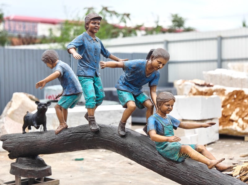 hree boys and a girl playing on a tree stump