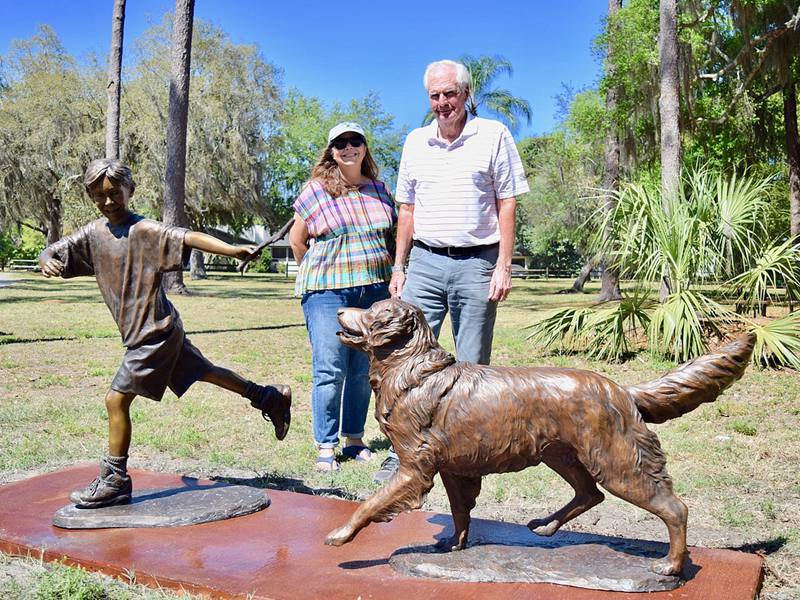 bronze boy and dog statue