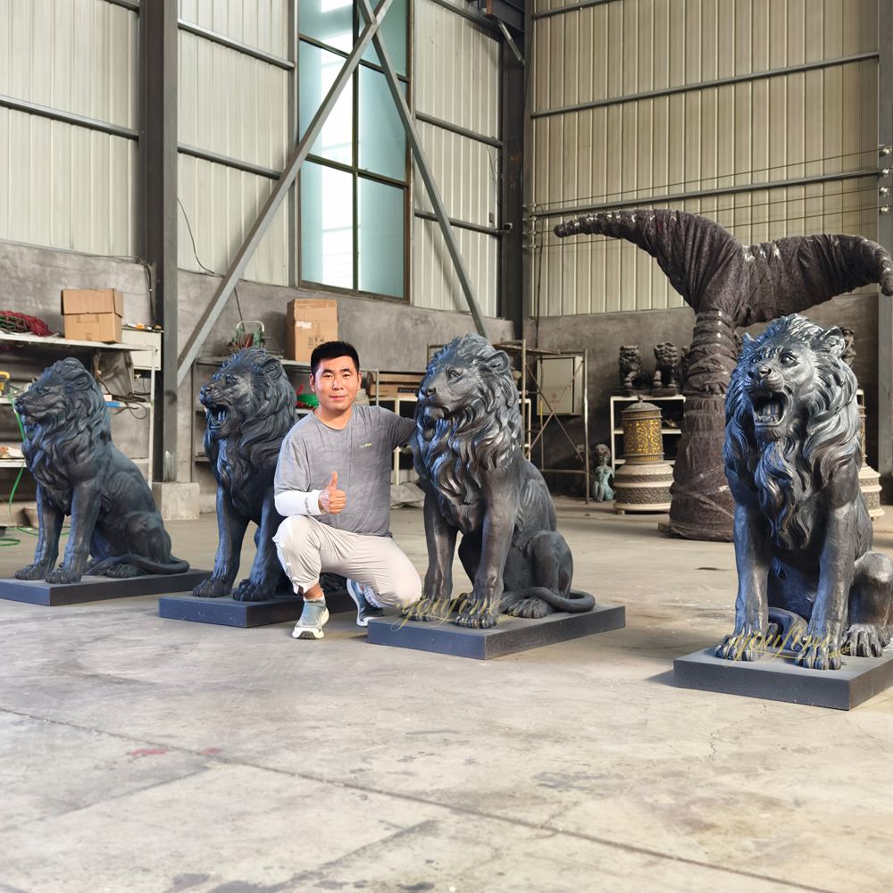 Black crouching lion sculpture