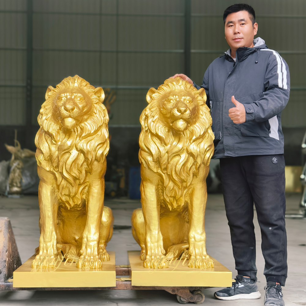 Golden crouching lion sculpture