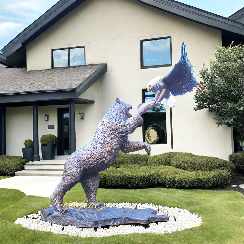 Bronze Fighting bear and eagle sculpture