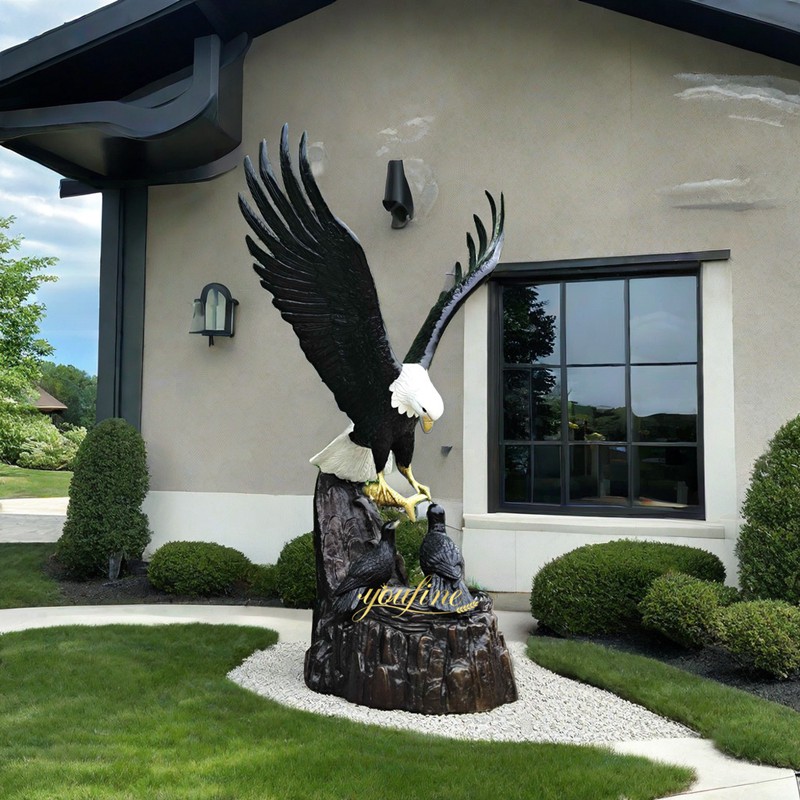 mother eagle feeding babies statue