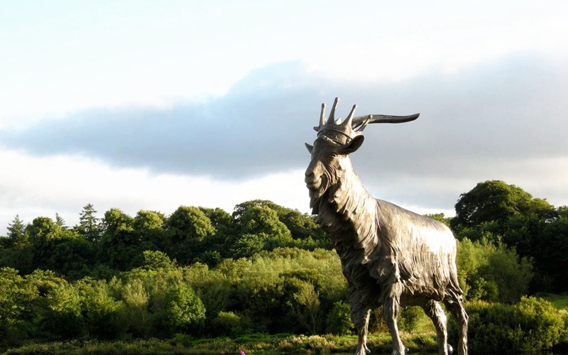 bronze statue of a proud male goat