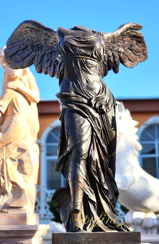 Brown and black sculpture of the goddess of victory