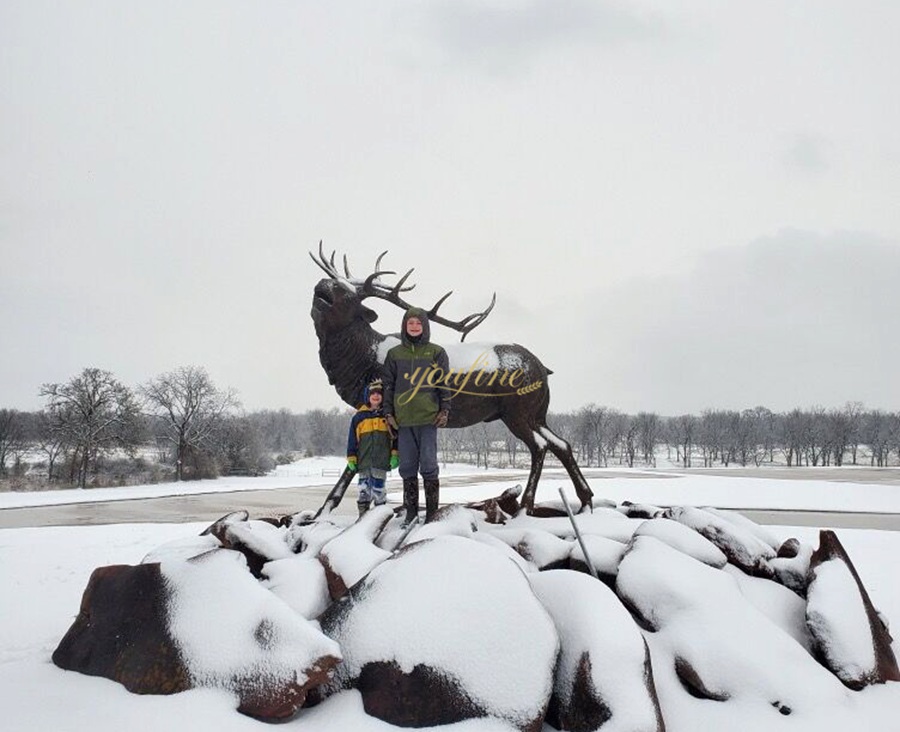 Large roaring deer sculpture