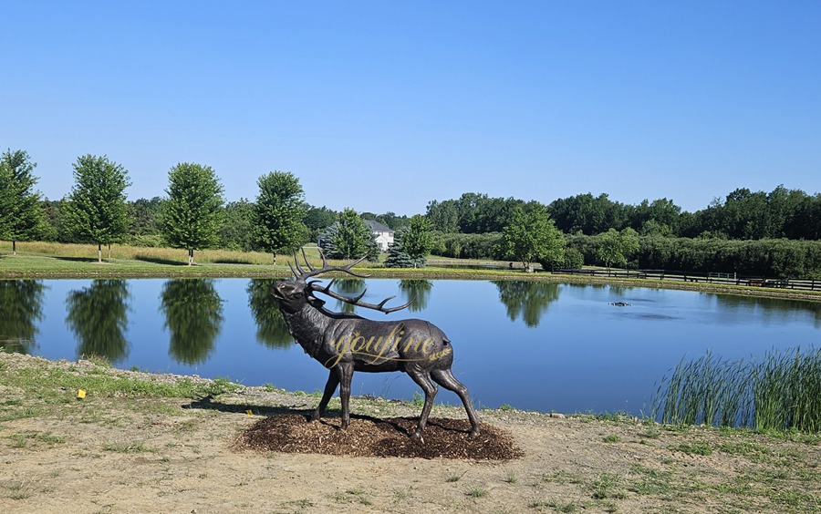 Sculpture of a roaring deer looking back