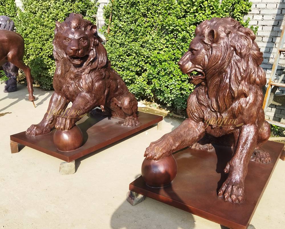 lion statue in front of a house Majestic Sculpture of a Lion Standing on a Ball