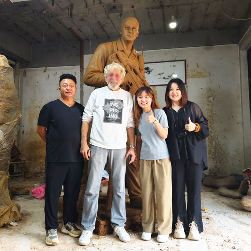 Client visiting YouFine Bronzes Gallery workshop in Quyang -- inspecting life-size bronze horse sculpture