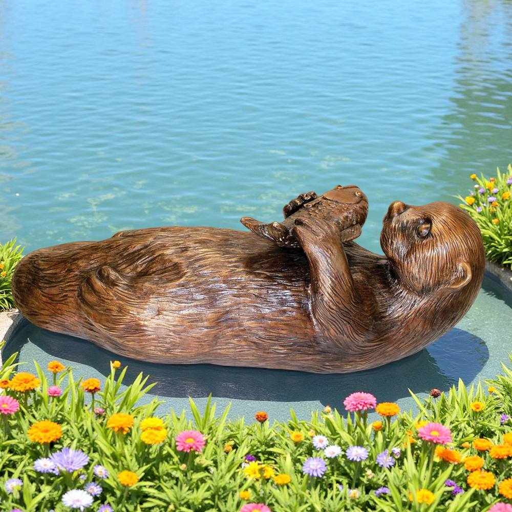 lively bronze sea otter statue