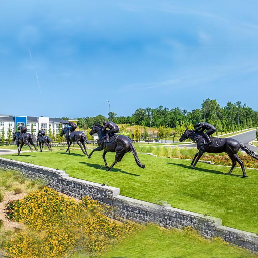 Bronze elk sculpture installed at golf course landscape feature