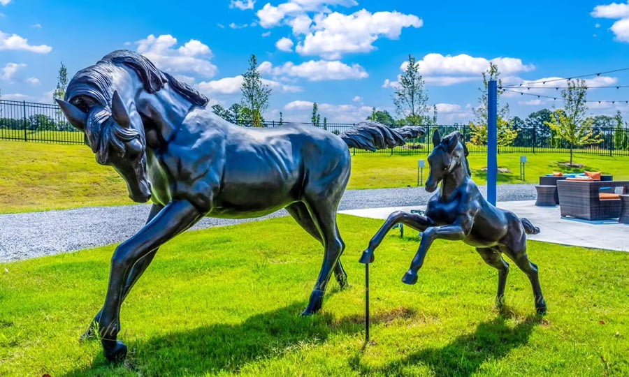 Large bronze eagle sculpture with wings spread, installed at a prestigious golf club in the United States