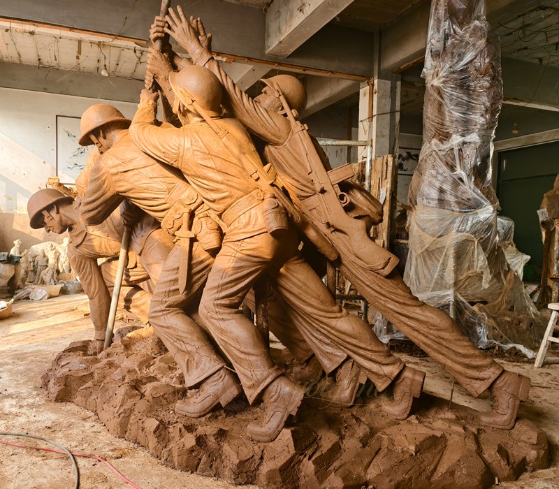 Master sculptor working on detailed clay model for client approval