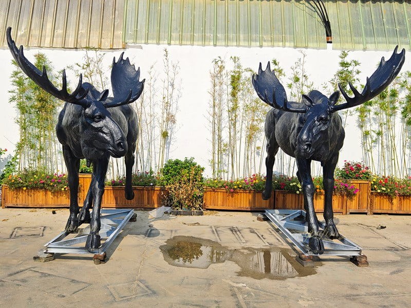 Artisan applying rich multi-toned chemical patinas under high heat to bronze sculpture