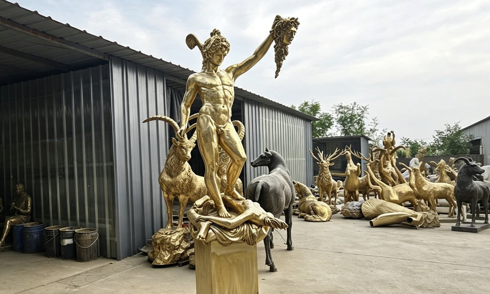 Artisan creating detailed clay model of bronze sculpture
