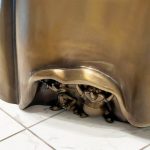 Close‑Up Detail of Hidden Mice Figures Under Skirt of Bronze Cinderella Sculpture