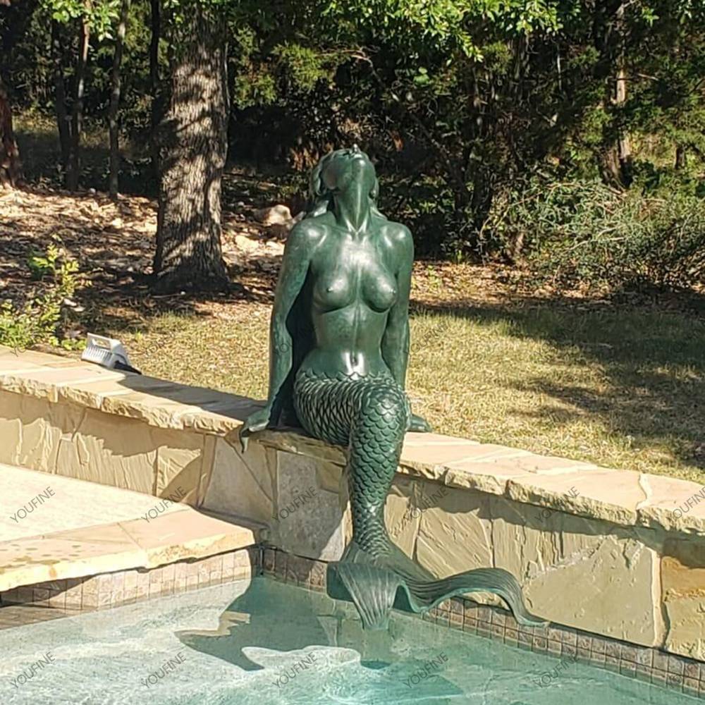 Customer feedback showing a green patina bronze mermaid statue beside a swimming pool in the United States